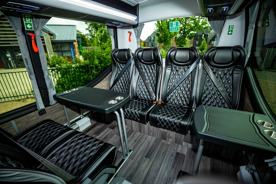 Minicoach rear area with seats and tables