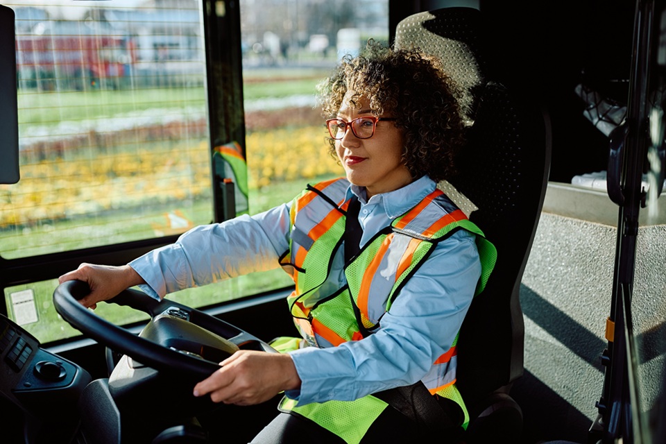 Woman driving a coach