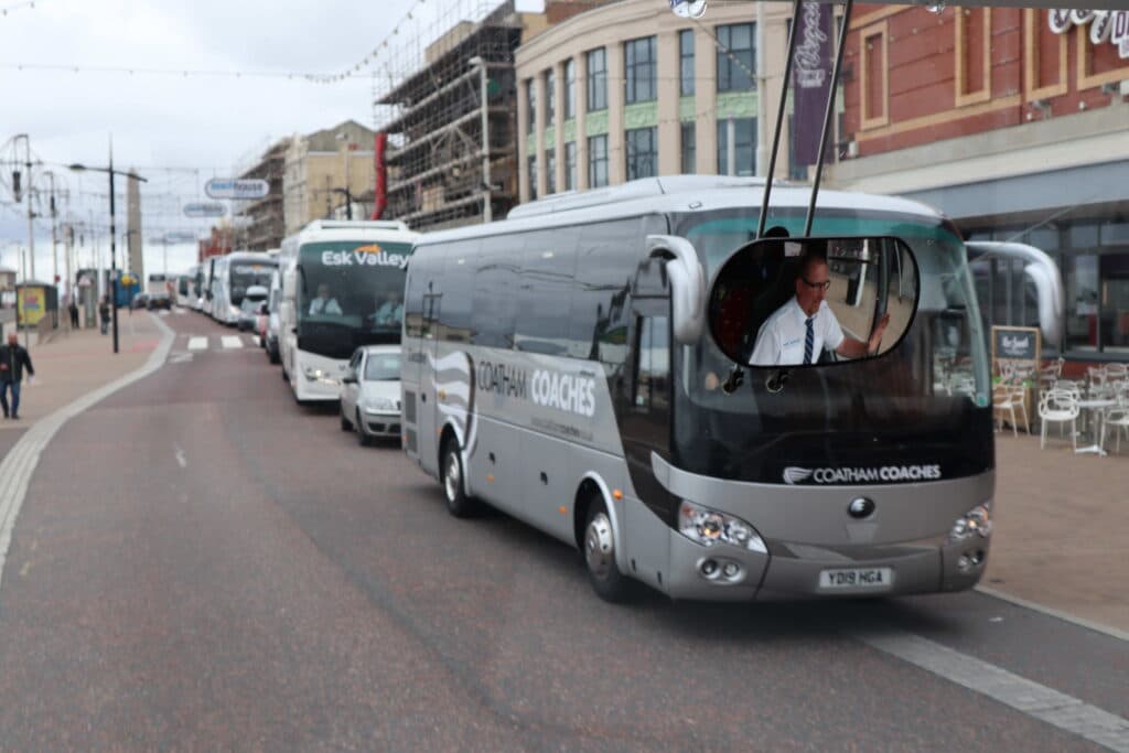 Honk for Hope coaches in Blackpool traffic