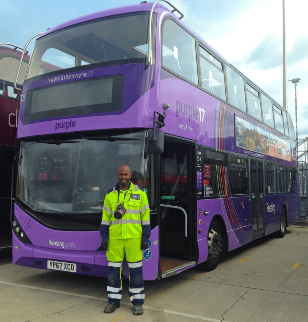 Mark Adams in front of a bus