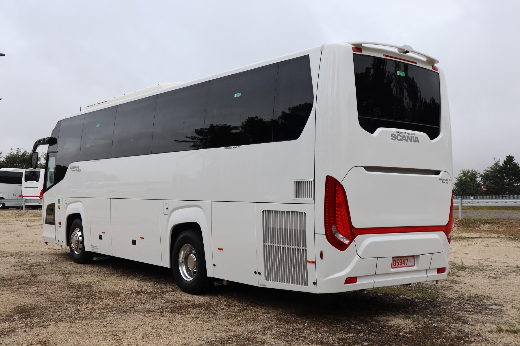 Rear view of white Scania coach