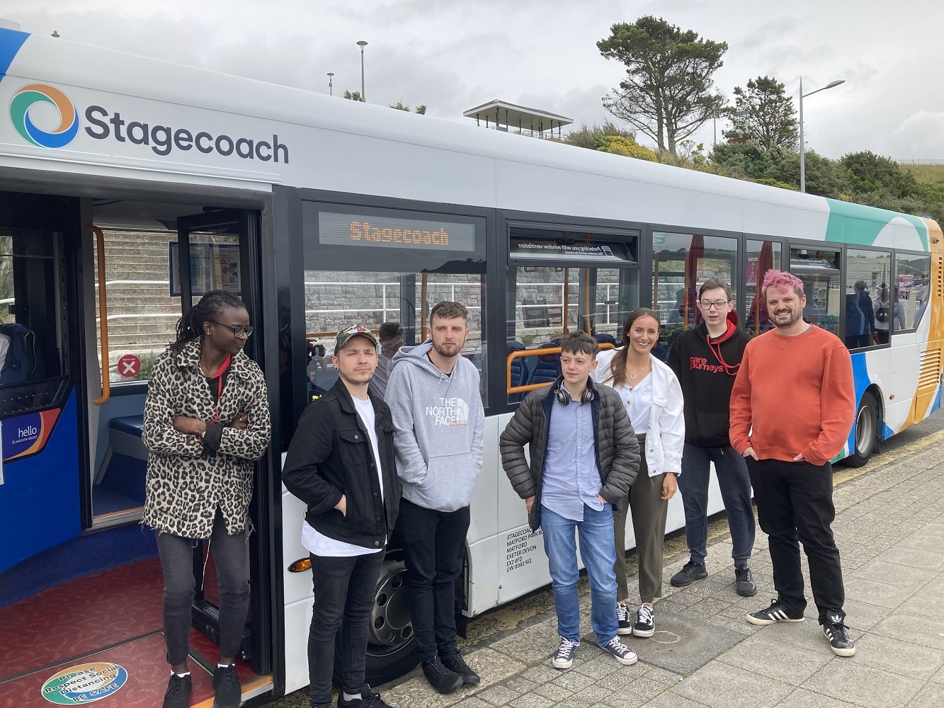 Barnardo's Plymouth Care Journeys in front of Stagecoach bus 2