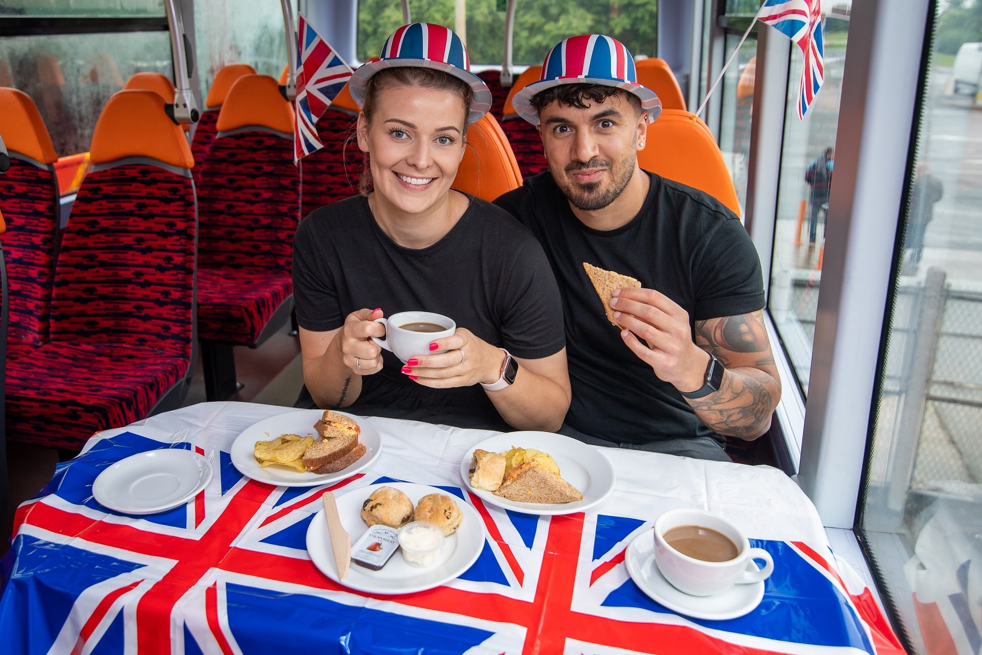 Guests take afternoon tea aboard a Mainline bus