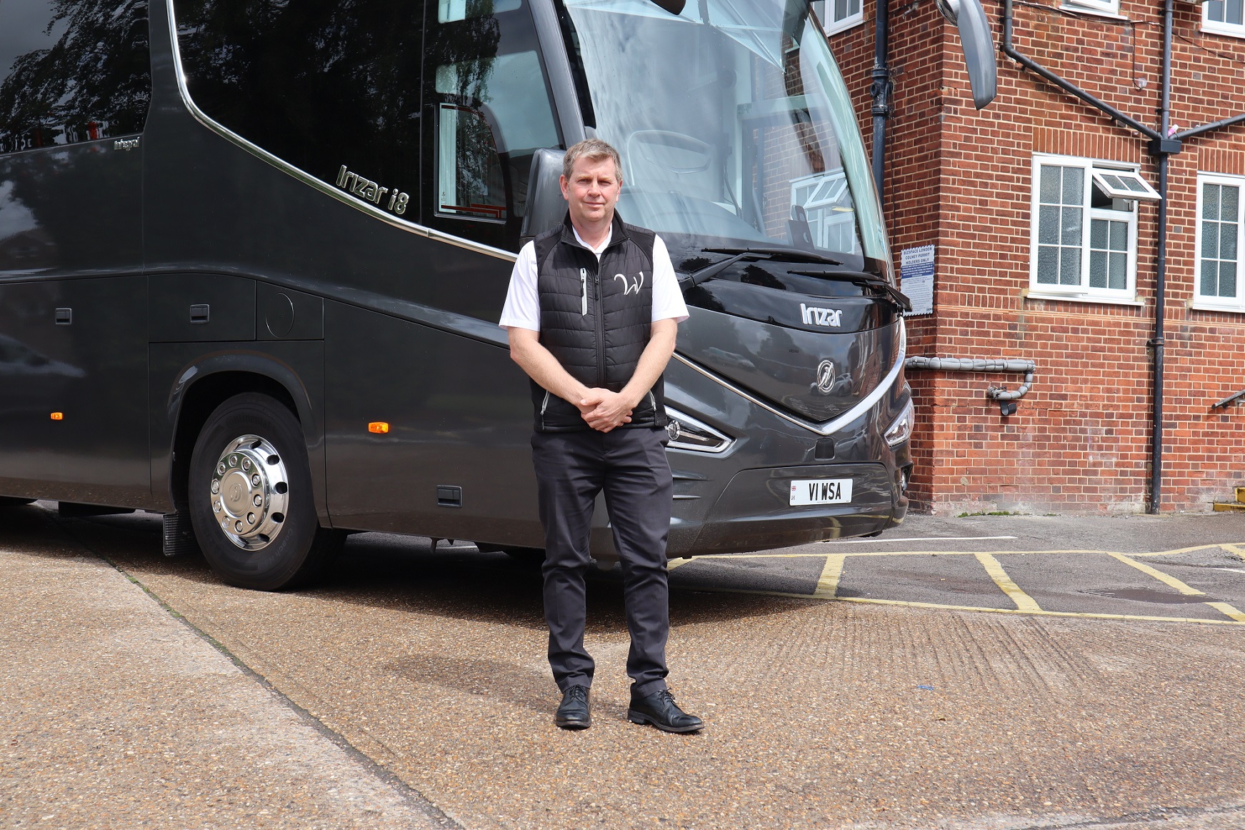 Greg White of Whites Coaches in front of Irizar i8 integral