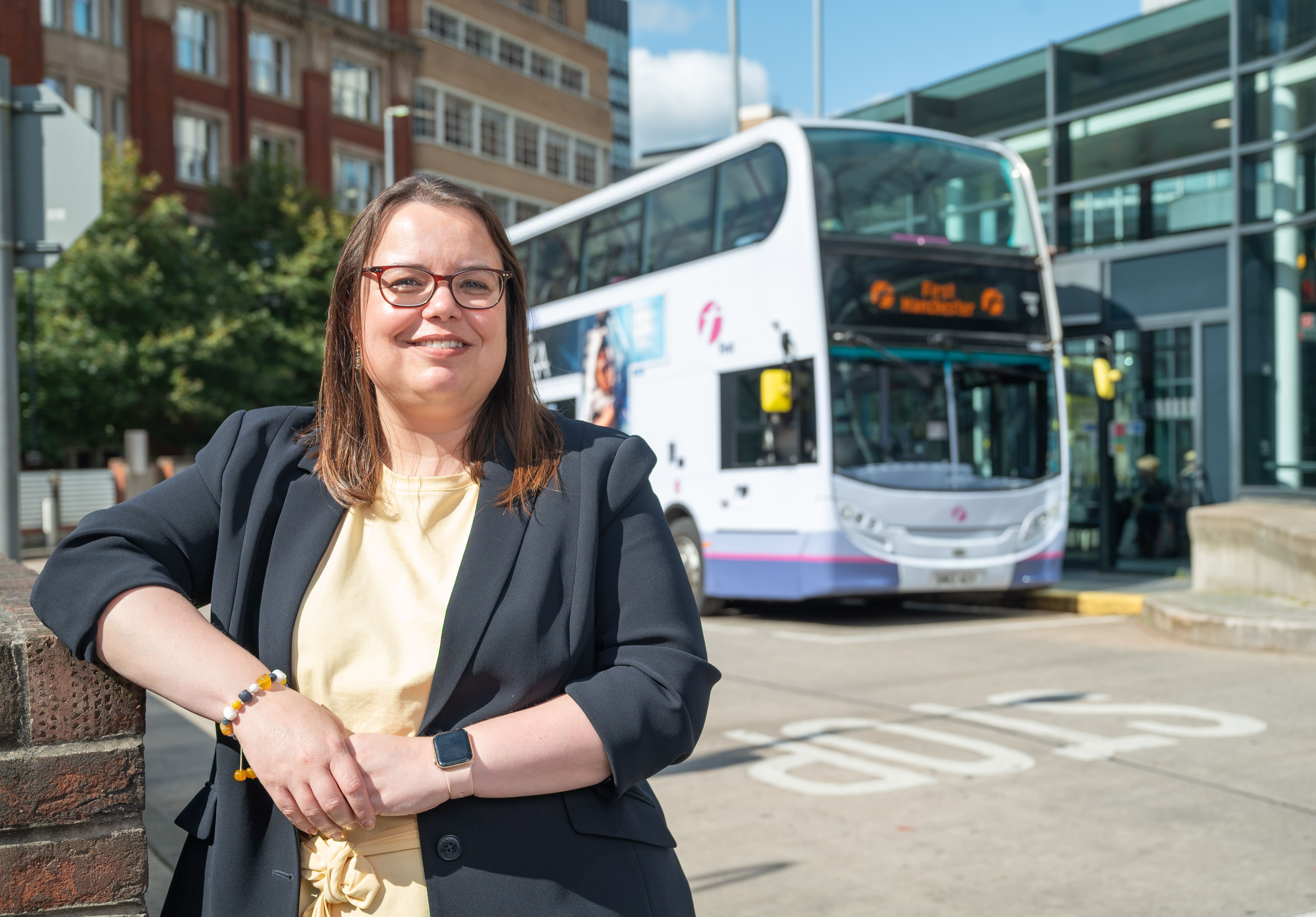 Photo of Zoe Hands in front of a First Bus bus