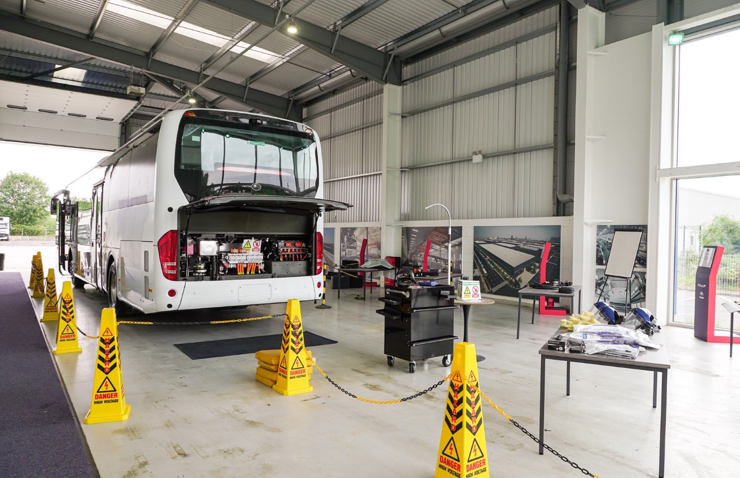 Photo of workshop area including the Yutong TCe12 Electric Coach Pelican