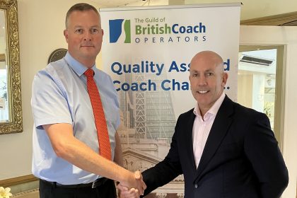 photo of Phil Hitchen of Belle Vue Manchester, right, with Anthony Winson, chairman of the Guild of British Coach Operators