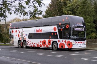 Stagecoach West unveils poppy liveried Oxford Tube coach