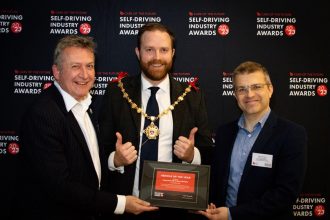 Councillor Rob Yates, Town Mayor of Margate, presents the Vehicle of the Year award at the Self-Driving Industry Awards to Peter Stephens, Public Affairs Director at Stagecoach, and Matt Lawrence, Fleet Business Development Director at Alexander Dennis