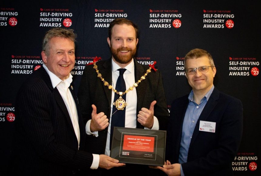 Councillor Rob Yates, Town Mayor of Margate, presents the Vehicle of the Year award at the Self-Driving Industry Awards to Peter Stephens, Public Affairs Director at Stagecoach, and Matt Lawrence, Fleet Business Development Director at Alexander Dennis