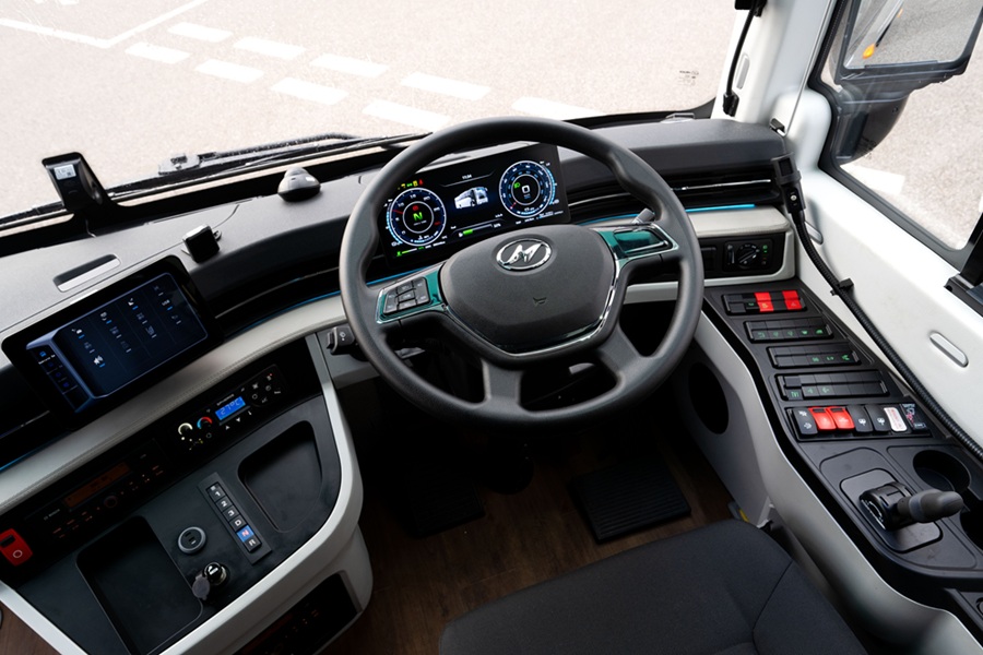 Cab area of luxury midicoach with steering wheel visible