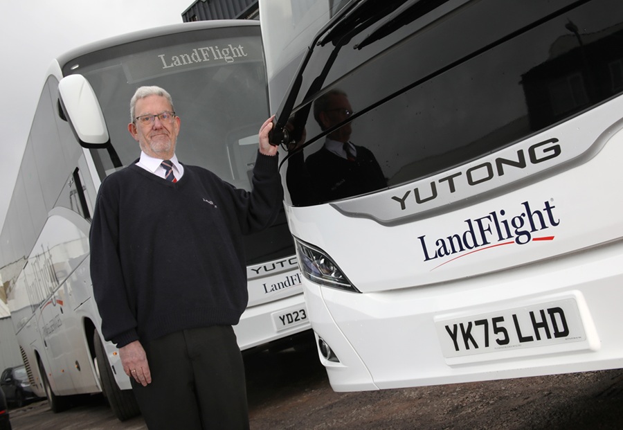 Trevor Baker, General Manager at LandFlight Travel Services, is pictured with the new Yutong coach