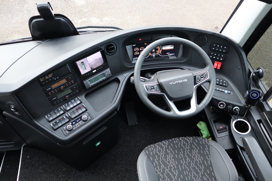 Coach cab area with steering wheel visible