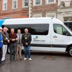 EVM hands over accessible minibus to The Children's Trust charity